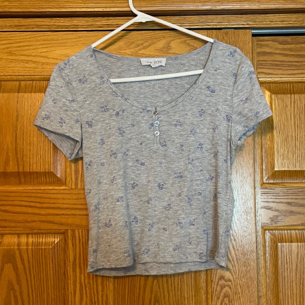 grey shirt with blue floral detail